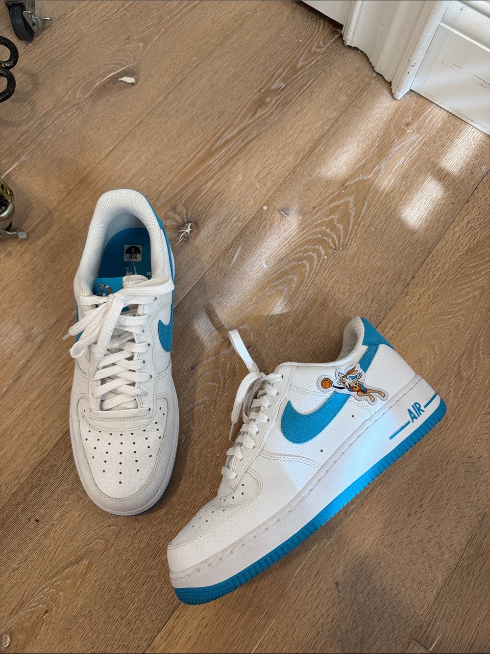 Nike White Sneakers with Bright Blue Swoosh and Cartoon Patch never worn